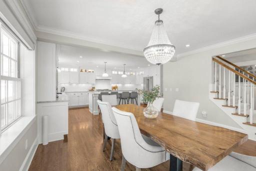 This dining room is open and airy, and flows seamlessly into the gourmet kitchen. It's the perfect place to entertain guests or enjoy a meal with family.
