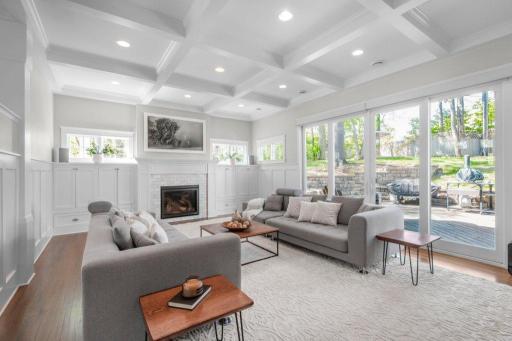 This room is large and airy, with lots of windows to let in natural light. The ceiling is coffered, which adds visual interest and a touch of elegance.