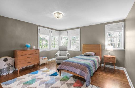 This bedroom is the third of four on the second floor. It is bright and sunny, thanks to the many windows.