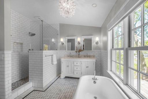 This bathroom is elegant, with a separate shower and clawfoot tub. The tub adds a touch of opulence.