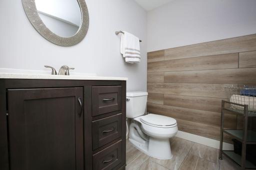 The lower-level half bathroom is perfect for guests.