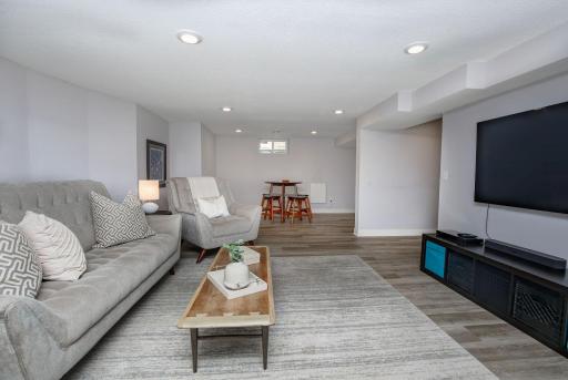 The lower level has newer LVP flooring throughout. Multiple places to watch the big game, your favorite movie or relax with friends. Beyond the lower-level family room is a card area and plumbed for a walk-up bar.