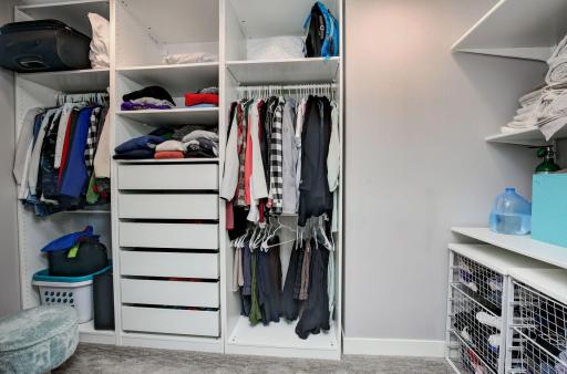 Oversized walk-in closet has professionally installed closet system- allowing everything to have its place.