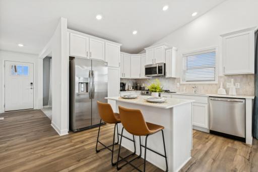 (Photo of decorated model, actual home's finishes will vary) This new two-story home showcases a modern design with a lower-level recreation room for versatility.