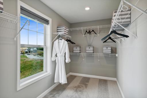 (Photos of model home, finishes will vary) This walk-in closet featured in the primary suite. Plus, this one features a wonderful closet window, a perfect way to brighten up everyday.