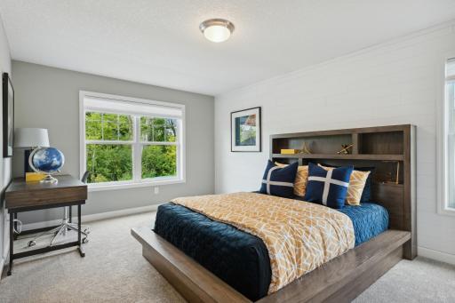(Photos of model home, finishes will vary) This generously sized upper level secondary bedroom with a spacious closet. This is the other bedroom attached to the dual entry bath.