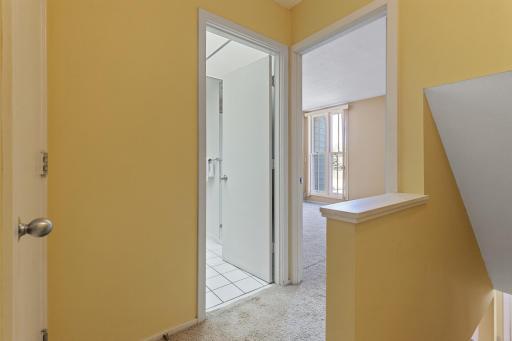 Upper level, looking into the full bath and 2nd Bedroom