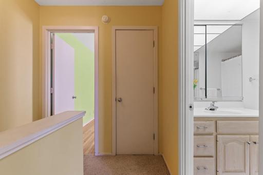 Looking toward the primary bedroom & large linen closet