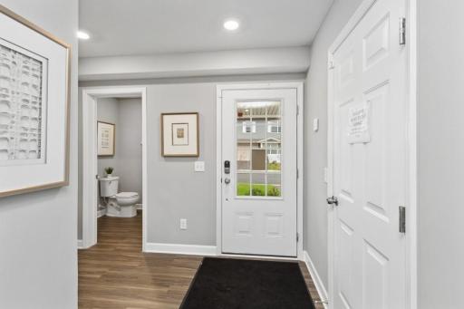 (Photo of decorated model, actual home's finishes will vary) Enter your new home! Front door/guest entry and garage entry with foyer area, coat closet, and half-bath powder room for the main level of the home.