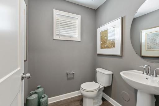 (Photo of decorated model, actual home's finishes will vary) Convenient powder bath on the main/first level, off the entry foyer.