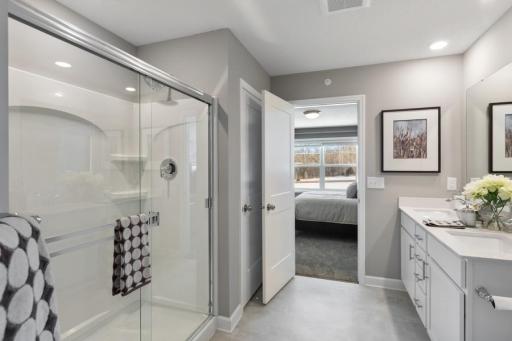 (Photo of decorated model, actual home's finishes will vary) Another view of the spacious owner's bath.