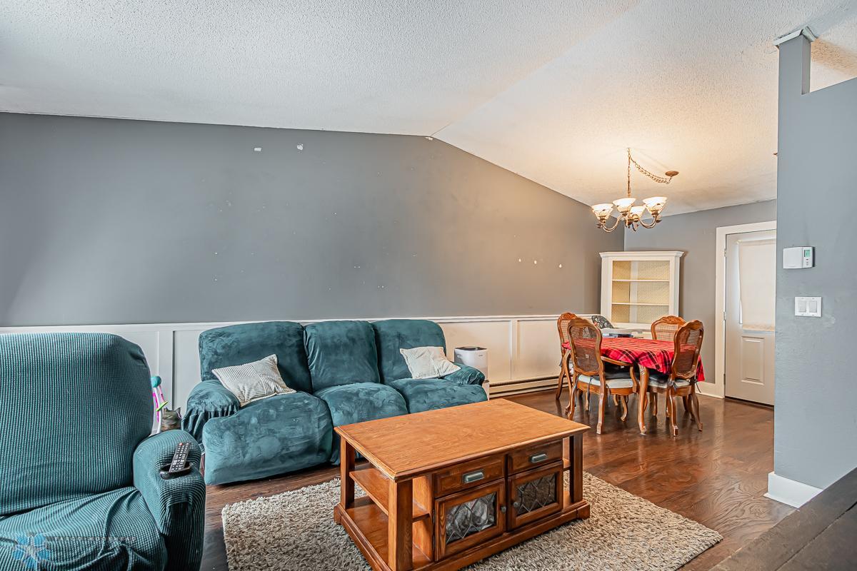 Living to Dining; dark laminate flooring