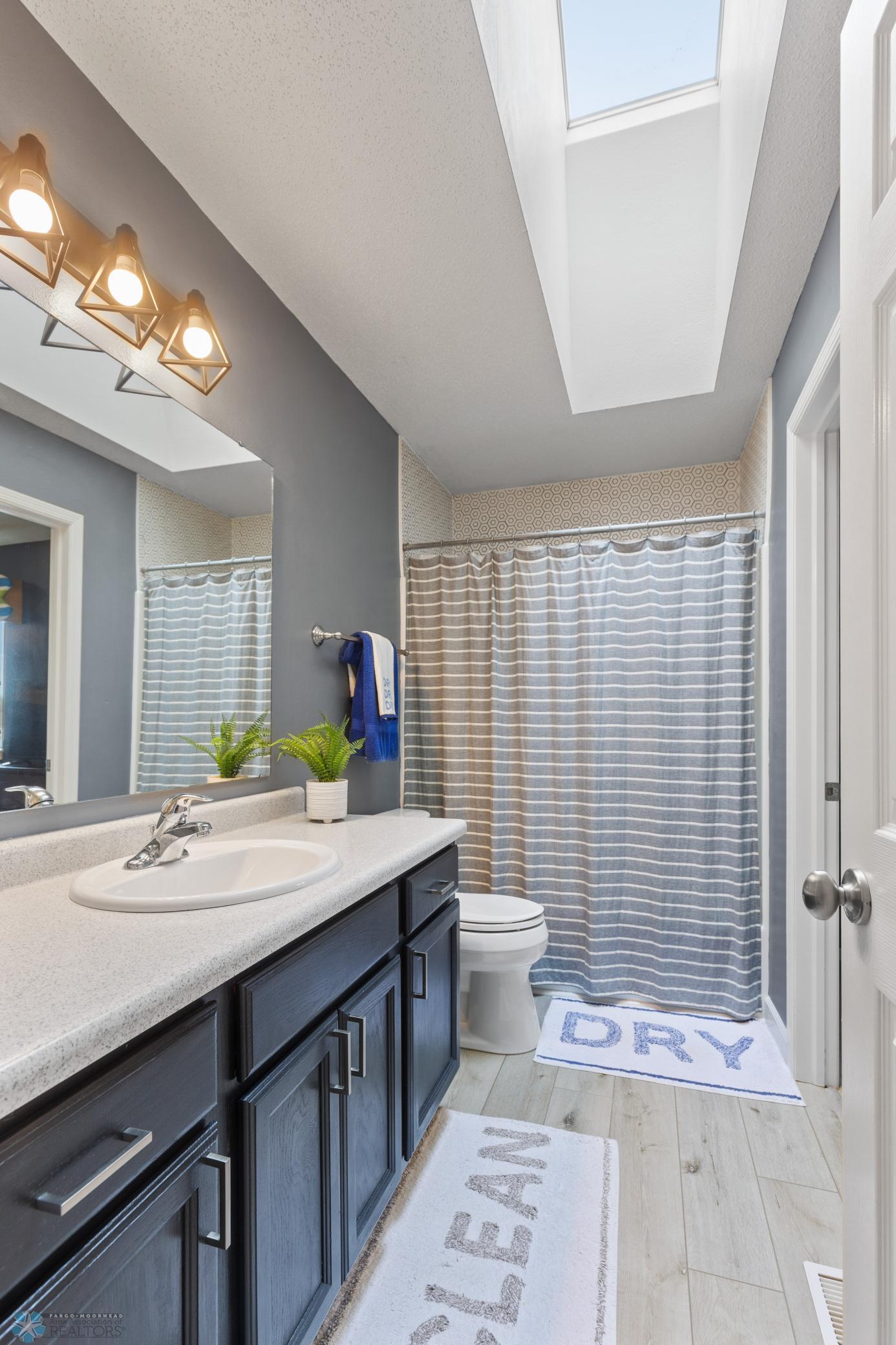 Bathroom - Access from hallway and bedroom.