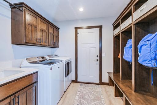 Mudroom with laundry. No more having to go all the way to the basement to wash clothes. Convenient storage to hang jackets and bags right when you get home.