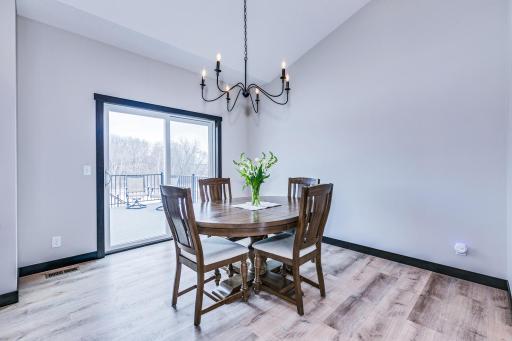 Dining space leads out to a maintenance free deck and view of back yard and preserve.