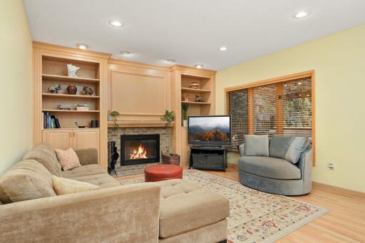 Family room with a handsome wood burning fireplace