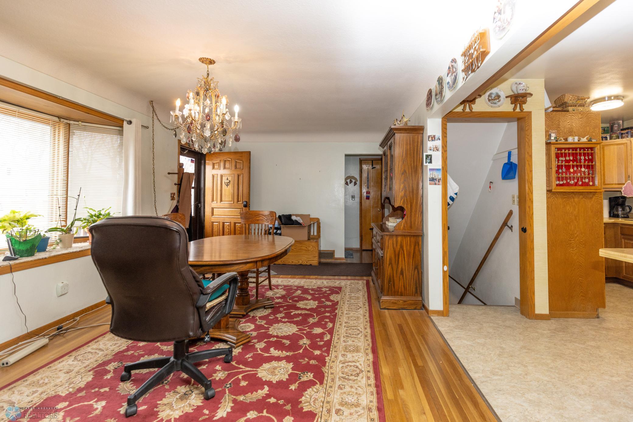 Access to basement between dining room and kitchen