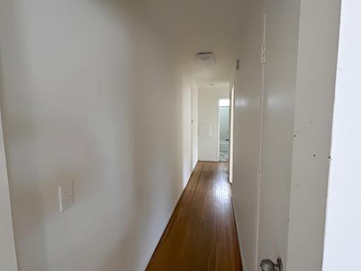 Hallway from main living area toward bedrooms and bath Unit 2