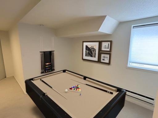 Basement Unit 2 Non Conforming Egress with an imagined pool table :)