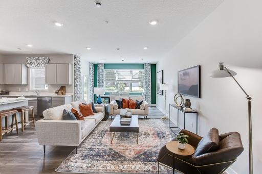 Open floor living main level with space for informal dining, too! Electric fireplace missing from photo. Photo of model home, finishes and colors may vary.