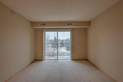 Living room with patio doors leading to private balcony.
