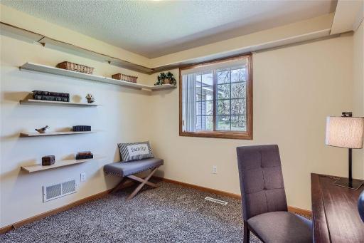 The shelving makes this room adaptable as a bedroom or office