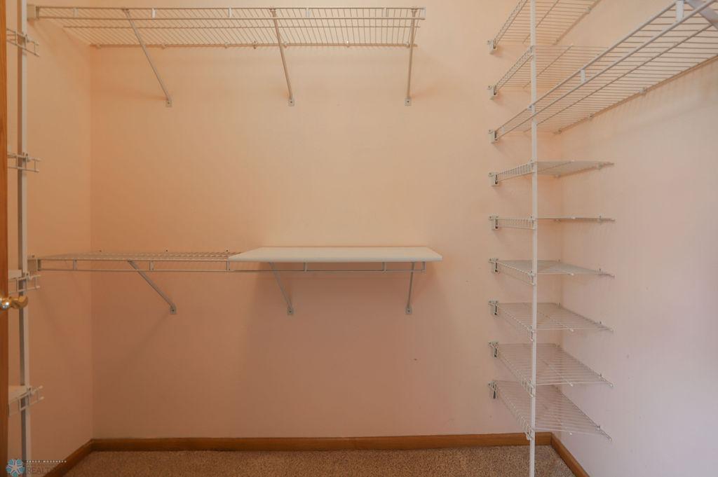 Primary bedroom walk-in closet