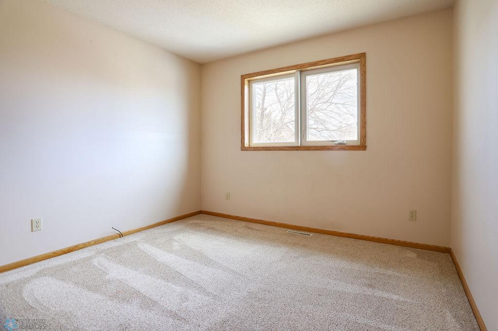 Bedroom #2 on upper level, across from primary