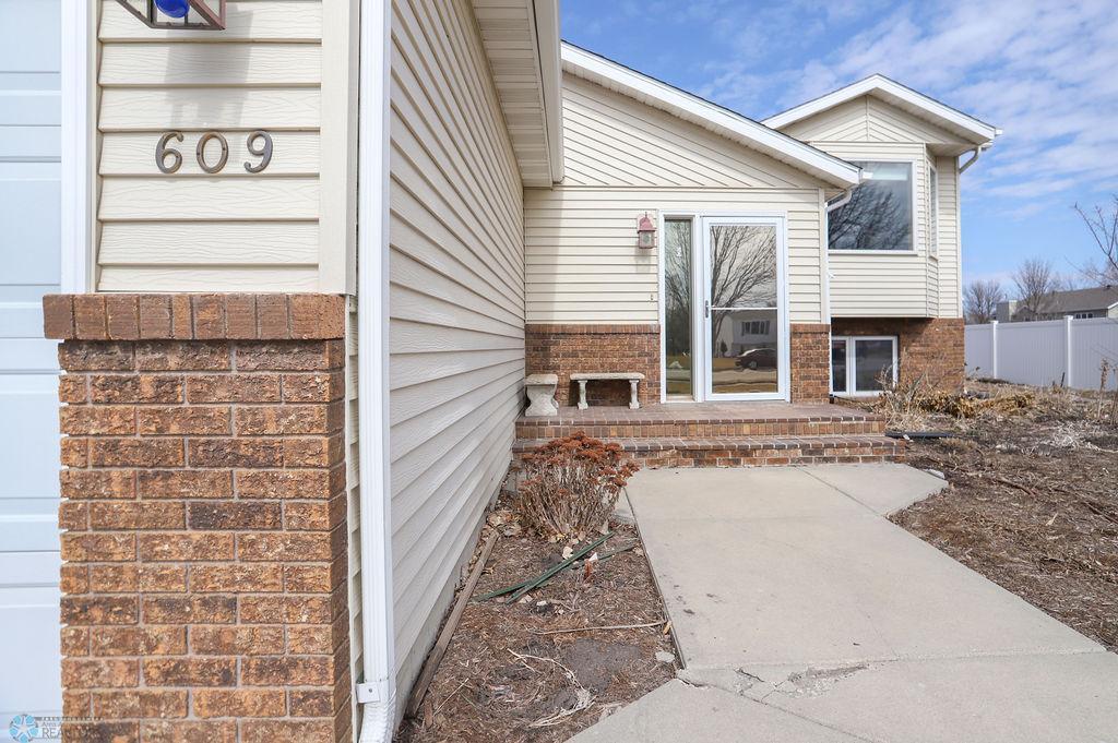 Storm door has reflective film for privacy