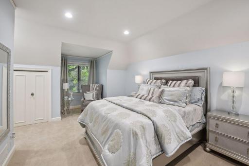 At the end of the hall lies the third bedroom, a haven of comfort. Here, a walk-in closet and second smaller closet offer ample storage solutions.