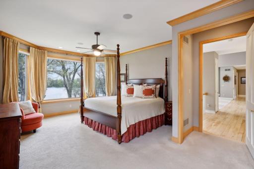 Primary bedroom w/ bay windows looking out to the lake