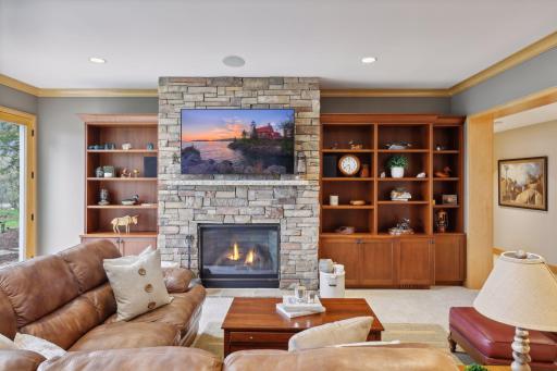 Beautiful fireplace surrounded by built-ins