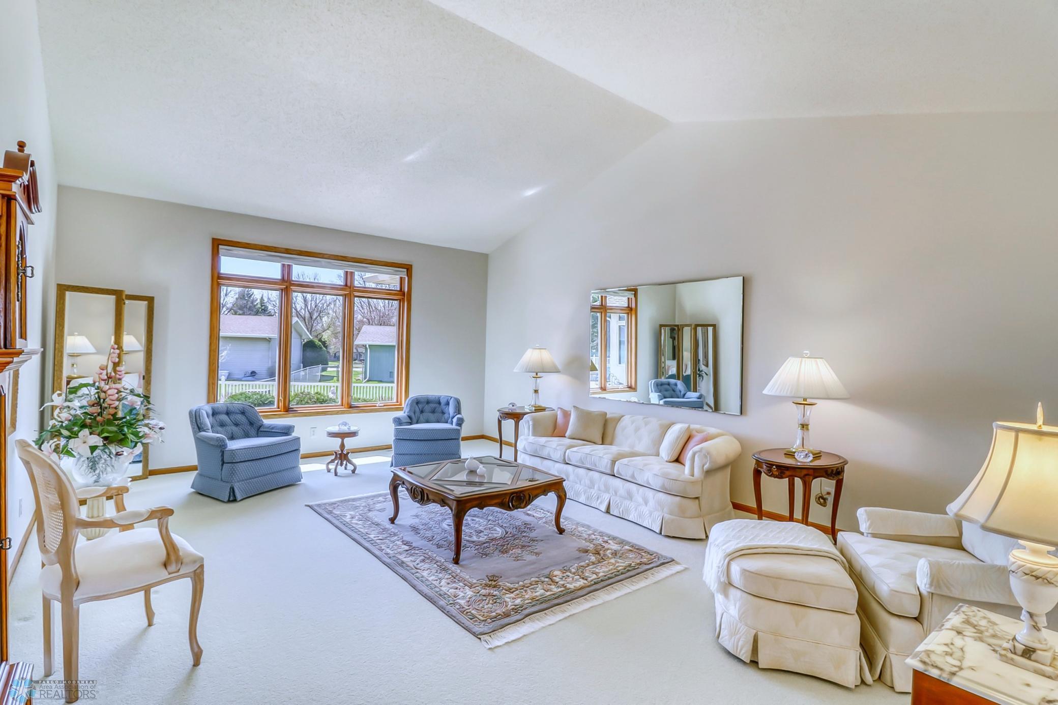 Formal living room-beautiful views to the landscaped backyard