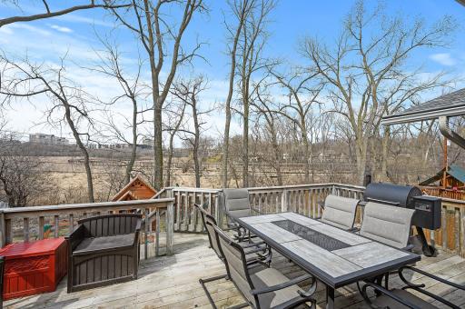 The deck overlooks the great yard and open area where you'll find the walking trail.