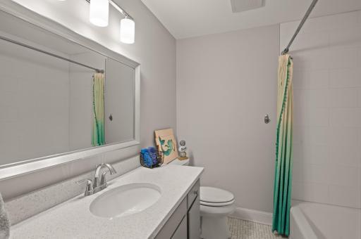 A full bathroom is a welcome way to round out this space.