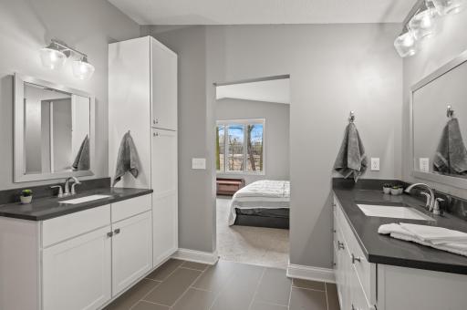 Spa-like luxury with stunning floors and dual vanities with storage.