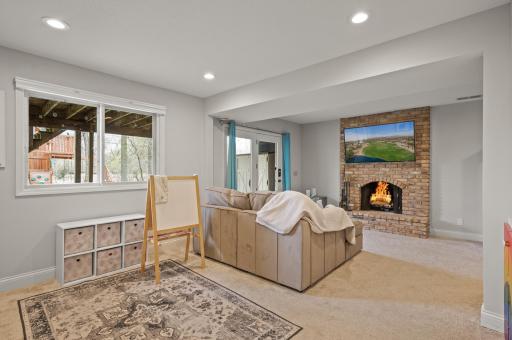 Enjoy the cozy brick fireplace and room for recreation and office space.