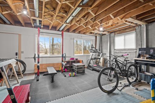 A partially finished space in the lower level is perfect as an exercise room, craft room or workshop!