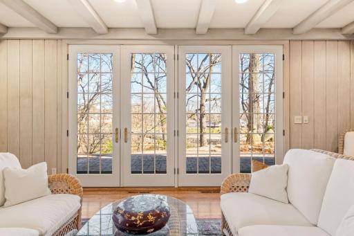 Beautiful french doors open up to the amazing patio and side walk area to the gazebo.
