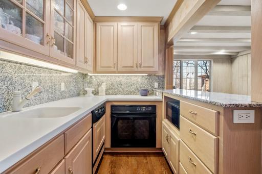 This second kitchen is complete with sink, dishwasher, oven, microwave and refrigerator, as well as all the cabinetry for storage and display!