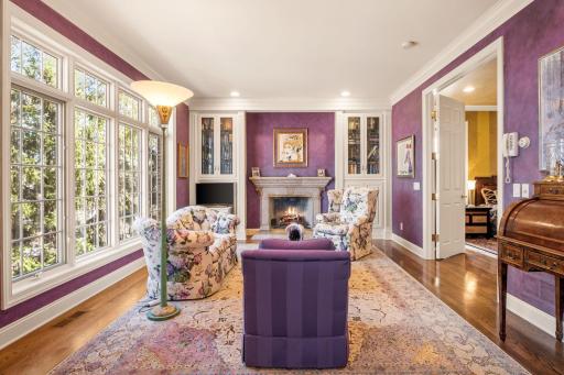 Sitting room to the main primary bedroom has its own fireplace, built-ins and unique design.