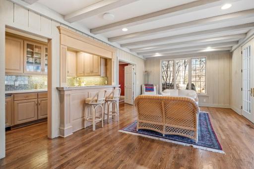 Space for multi-generational living with this kitchen, breakfast bar and another sitting area.