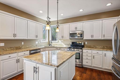 Beautiful white cabinetry with stainless steel appliances.
