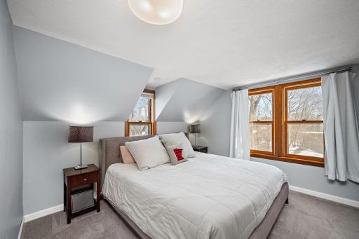 Upper level bedroom #2. This primary suite offers a convenient 1/2 bath. 8541 Kennedy Memorial Drive, Saint Bonifacius, MN 55375