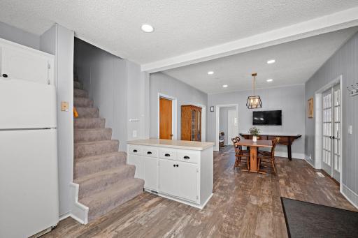 The breakfast bar offers storage on both sides. Stairs lead to loft and Upper Bedrooms. Primary has a convenient en-suite 1/2 bath. 8541 Kennedy Memorial Drive, Saint Bonifacius, MN 55375