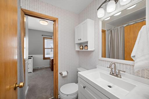 Main floor full bathroom offers smart improvements and walks through to the main floor bedroom and dining room. 8541 Kennedy Memorial Drive, Saint Bonifacius, MN 55375