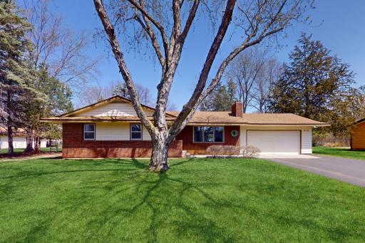 Come home to this charming rambler in Elk River!