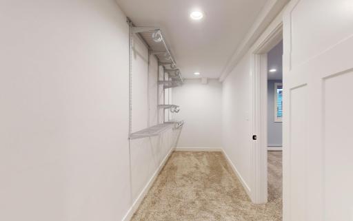 Step into the walk-in closet adjacent to the lower-level bedroom, a spacious storage haven to keep your belongings organized and easily accessible.