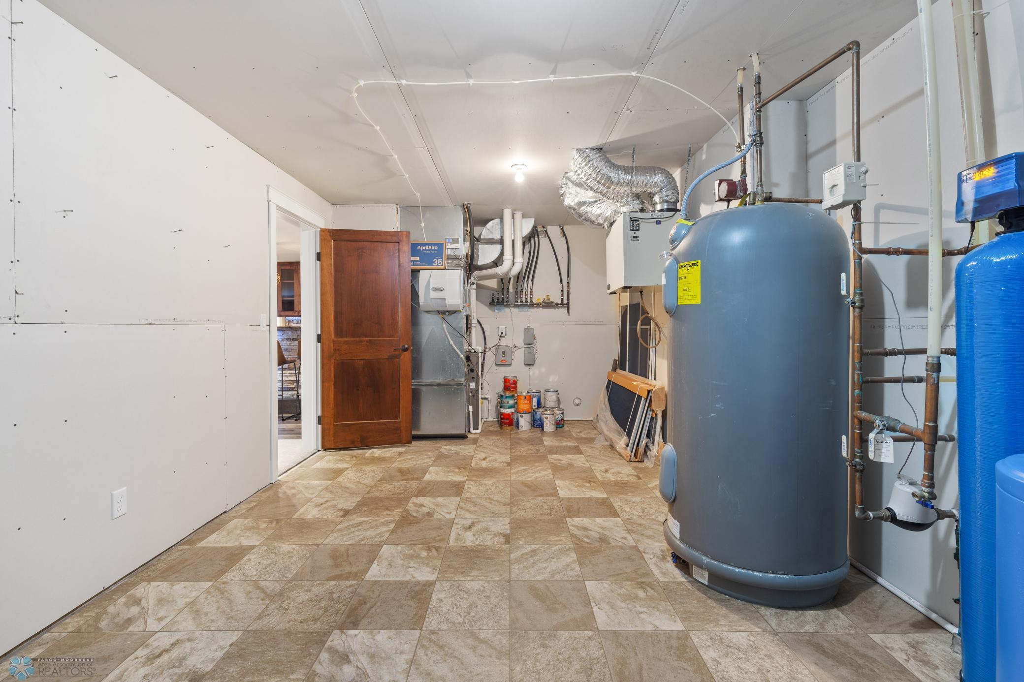 Mechanical room: Marathon water heater, aprilaire humidifier, dual zone heat, air exchanger and radon mitigation system