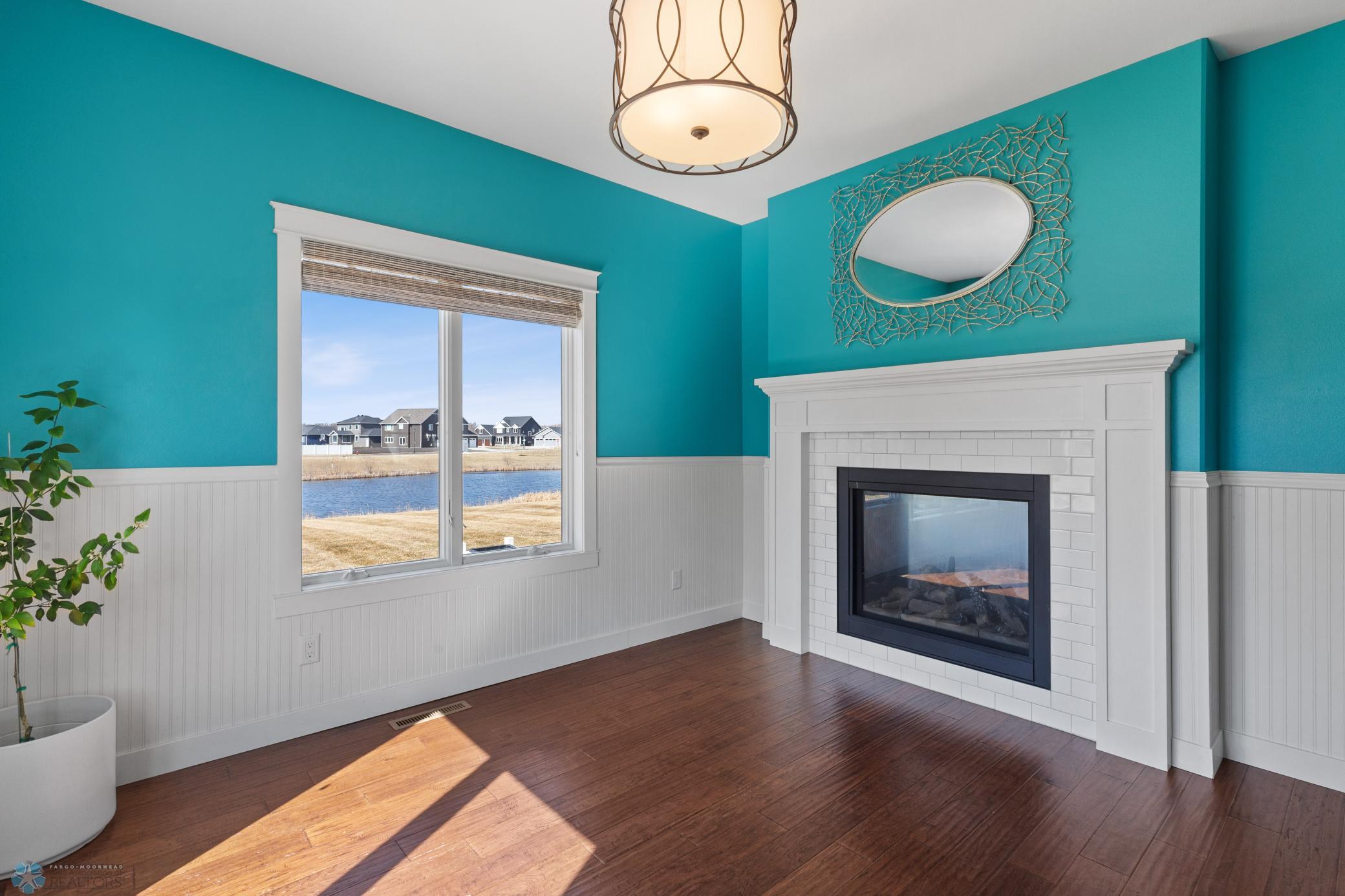 Back side of fireplace is in this cheery flex room!
